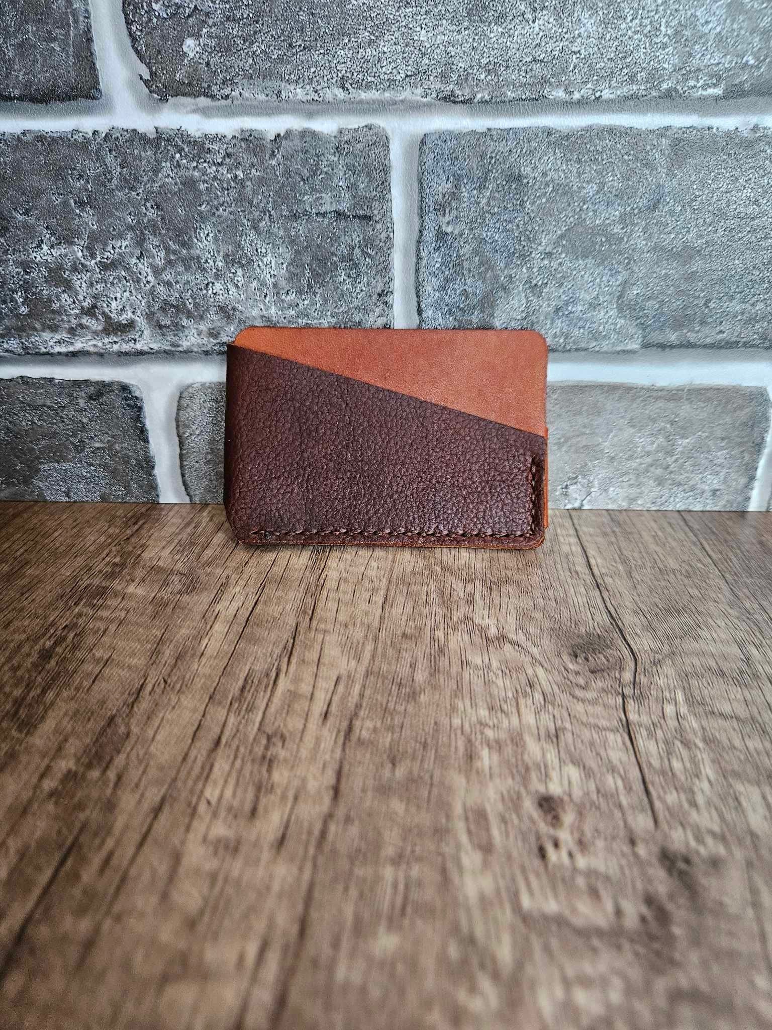 Burgundy leather wrap wallet with tan interior and visible wrap panel