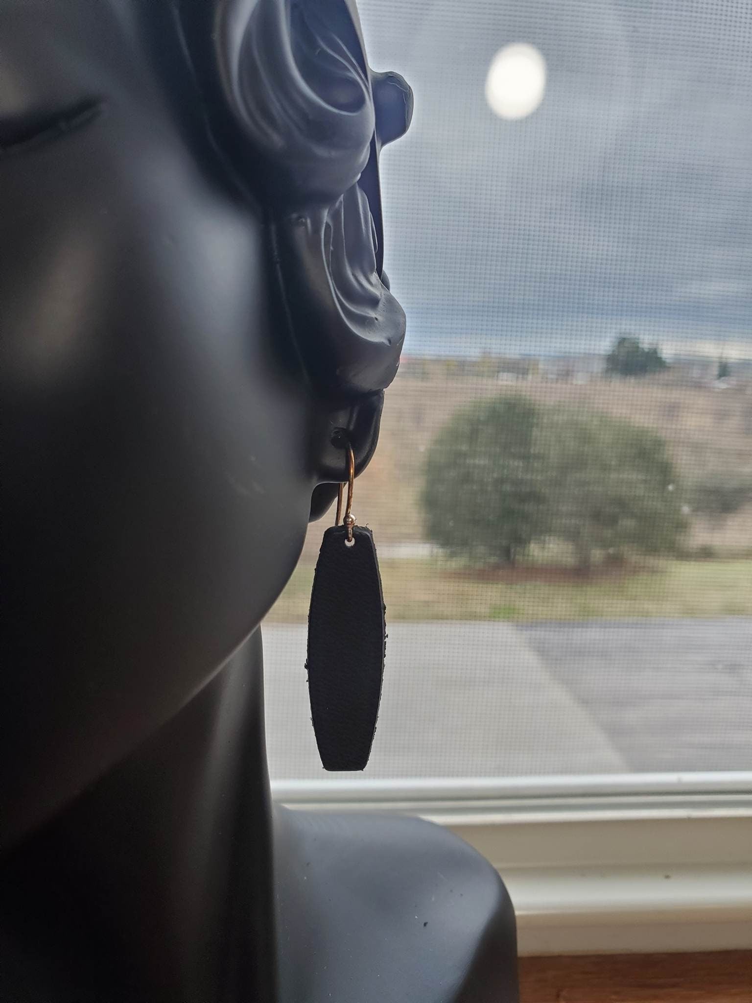 Black leather drop earrings, dangling oval leather pieces with silver hooks