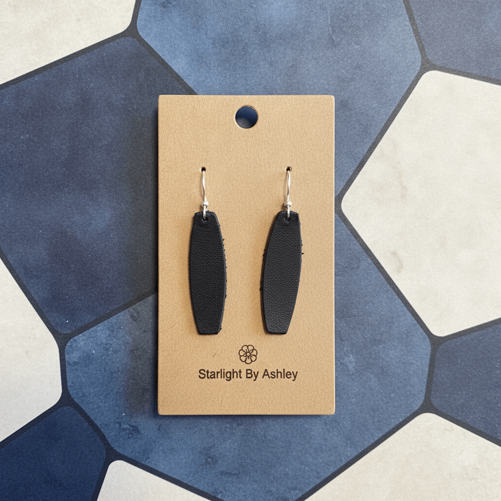 Black leather drop earrings with silver-tone hooks