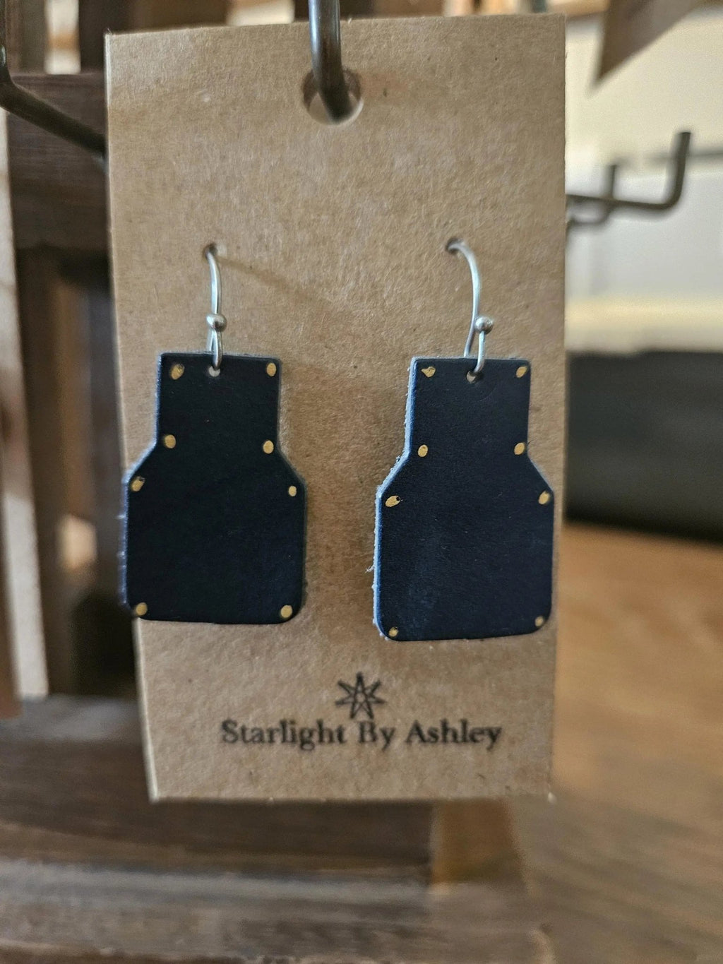 Blue geometric leather drop earrings with small dot details and silver hooks