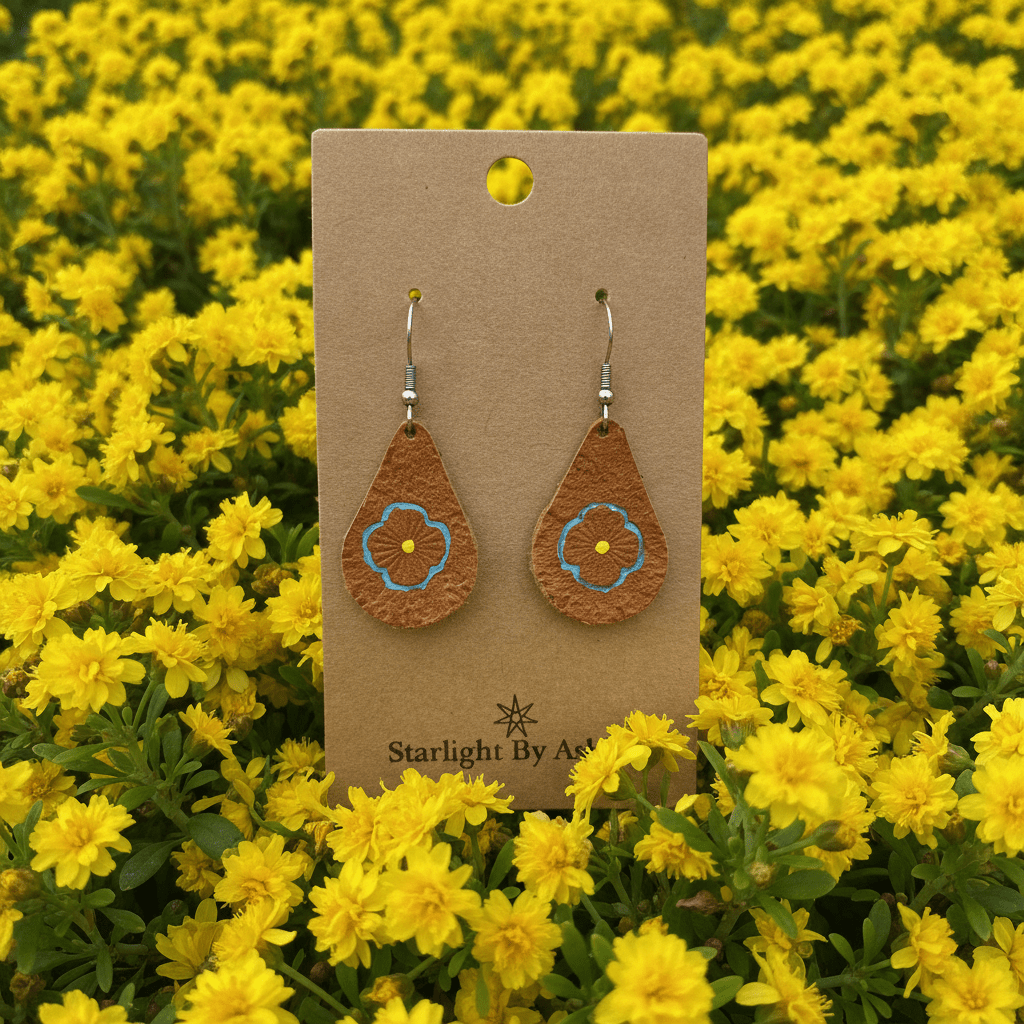Brown leather teardrop drop earrings with blue painted flower center