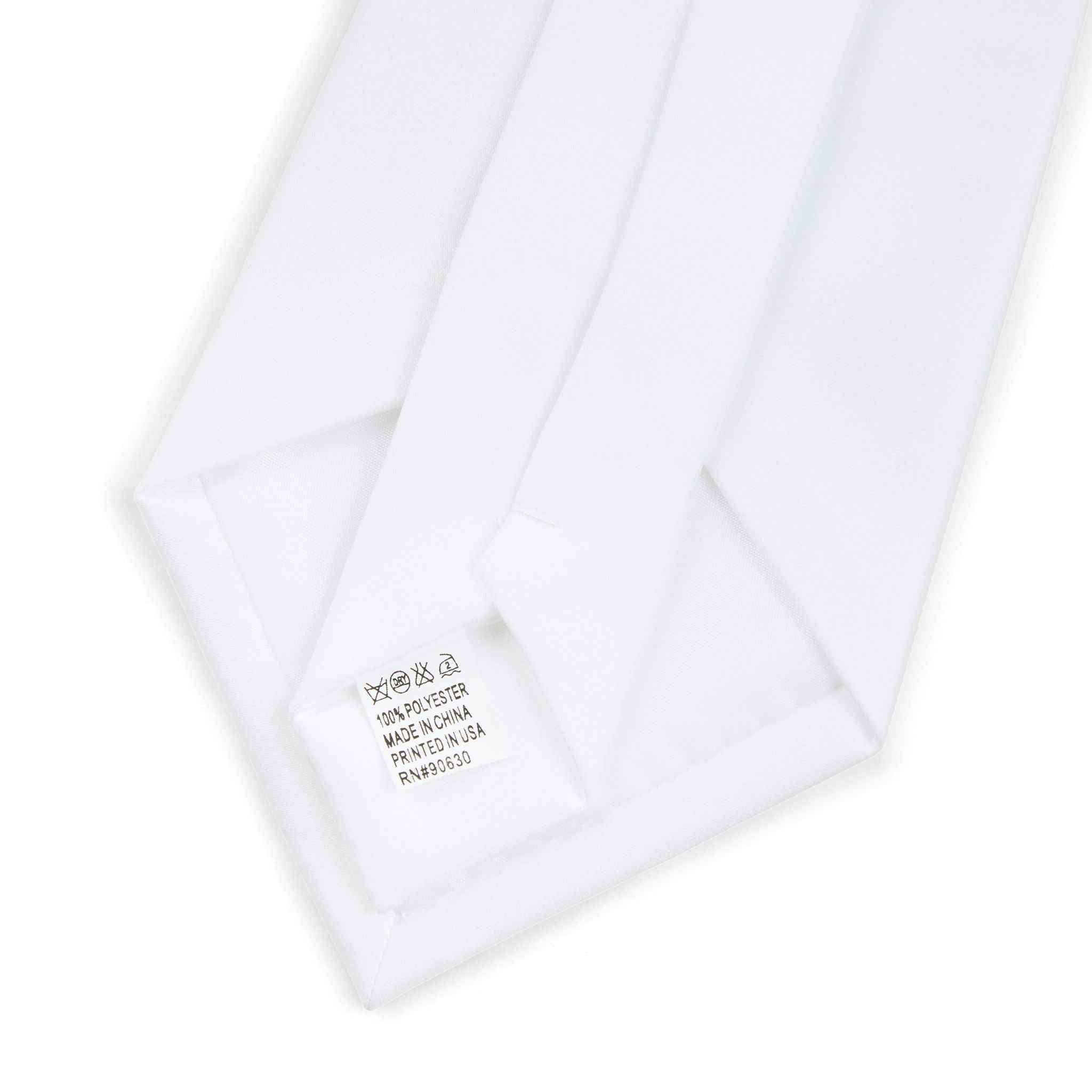 Men's necktie tip with white fabric label stitched inside