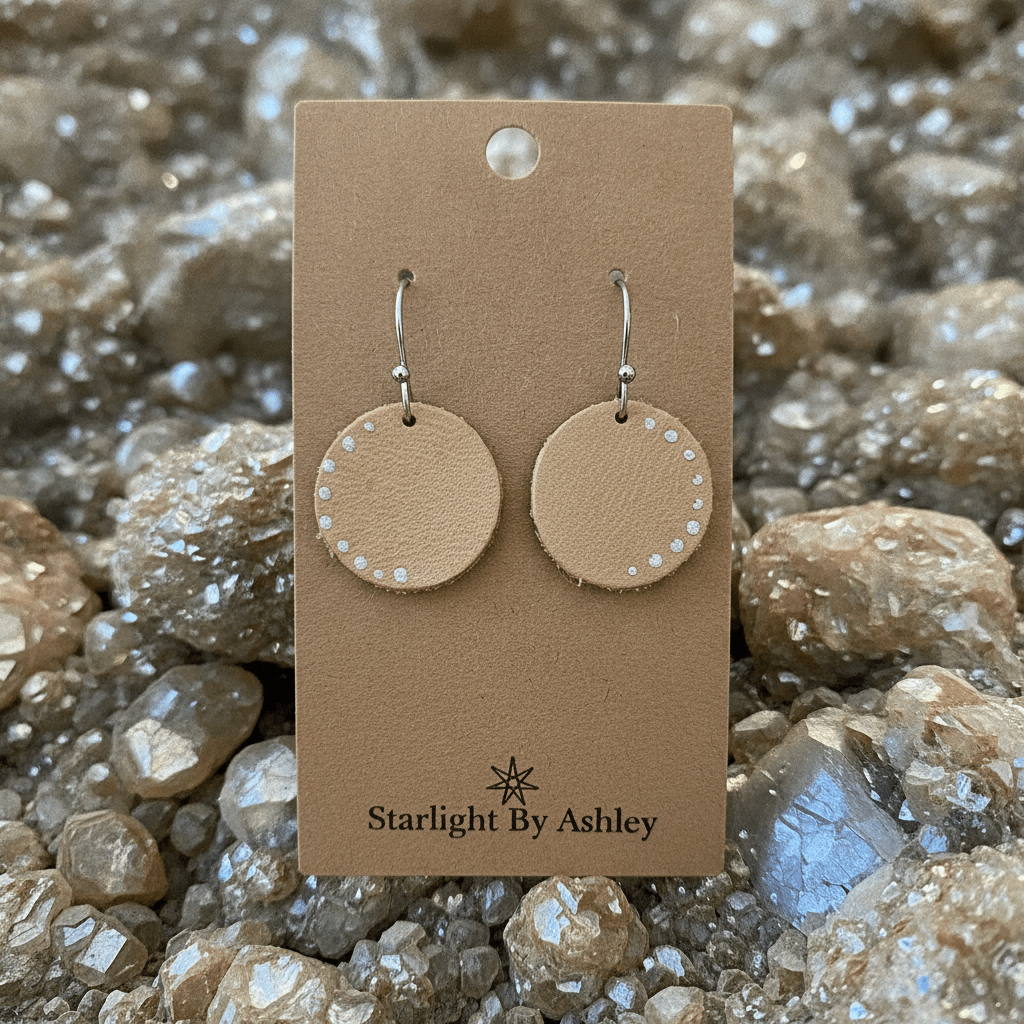 Beige leather circle earrings with dotted border and silver hook backs