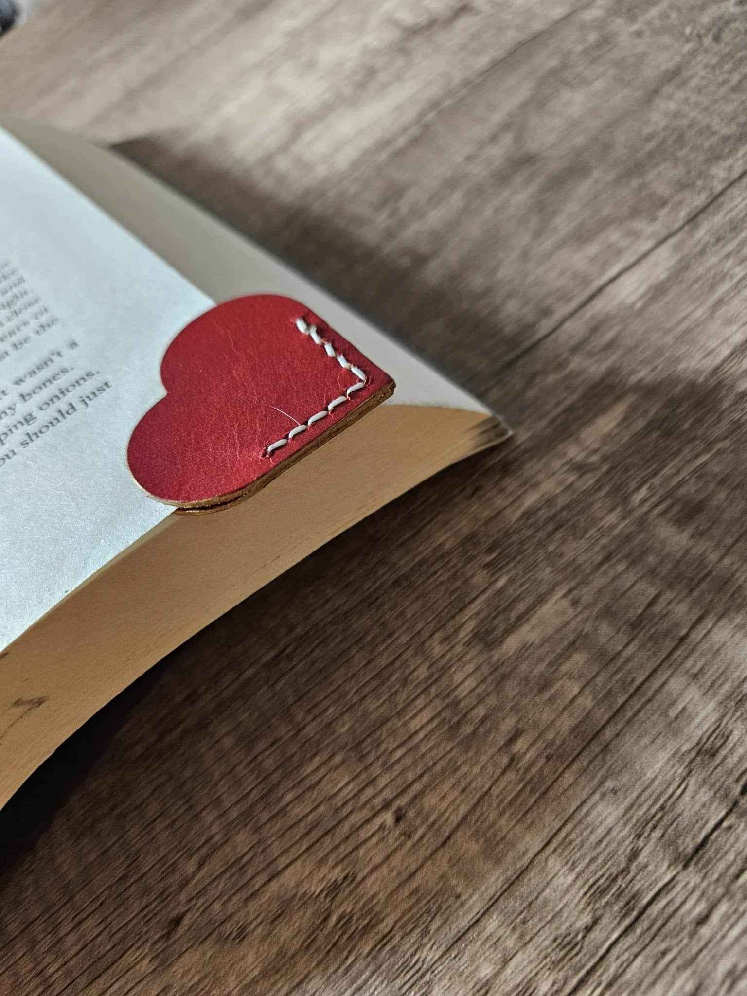 Red heart leather page corner bookmark with white dashed stitching