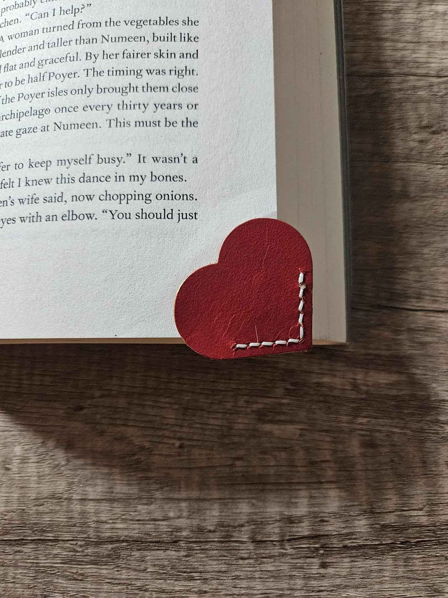 Red heart leather bookmark page corner with white dashed stitching