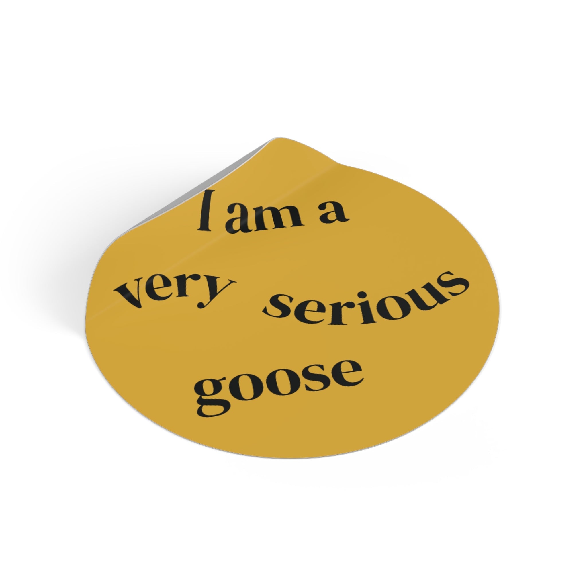 Tilted round yellow vinyl sticker with black “I am a very serious goose” text