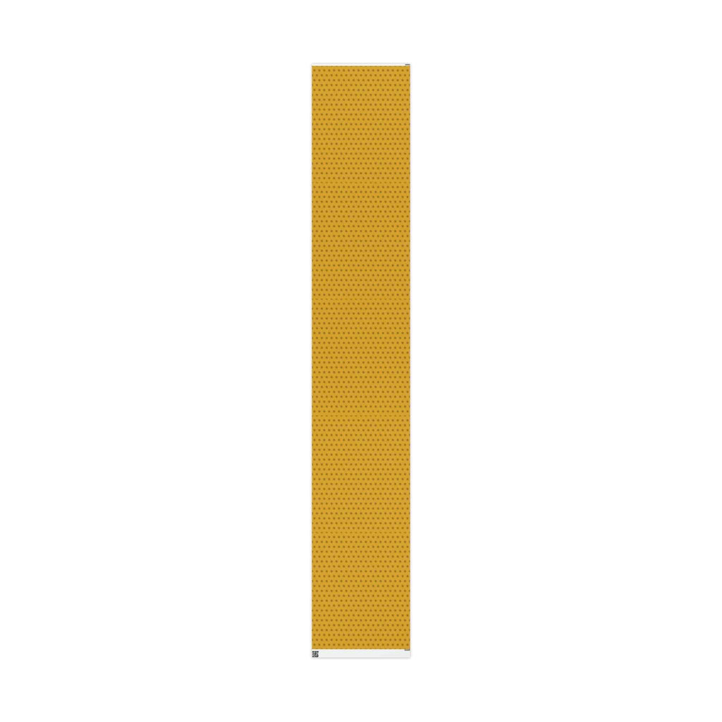 Narrow strip of yellow wrapping paper roll showing seven-point star pattern