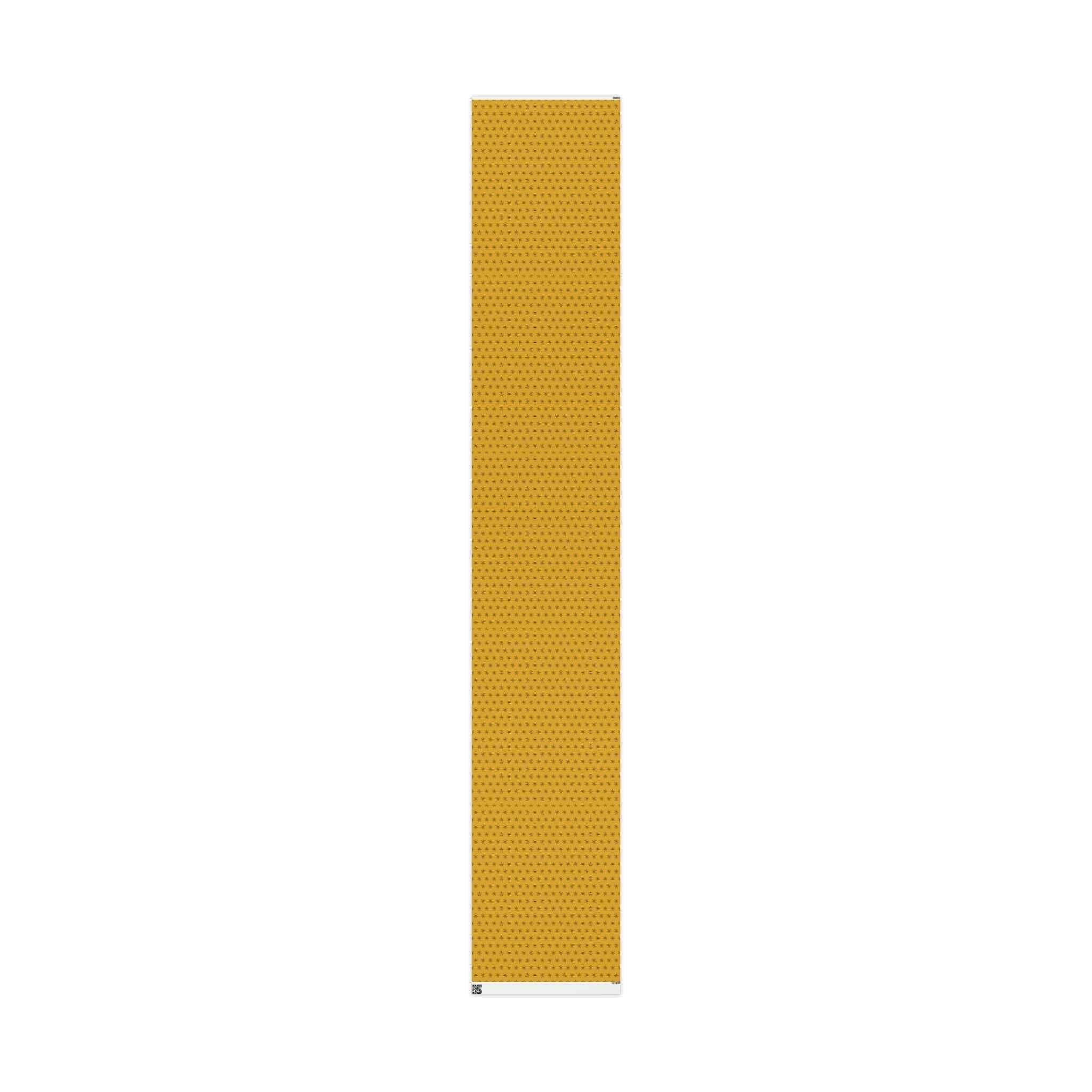 Narrow strip of yellow wrapping paper roll showing seven-point star pattern