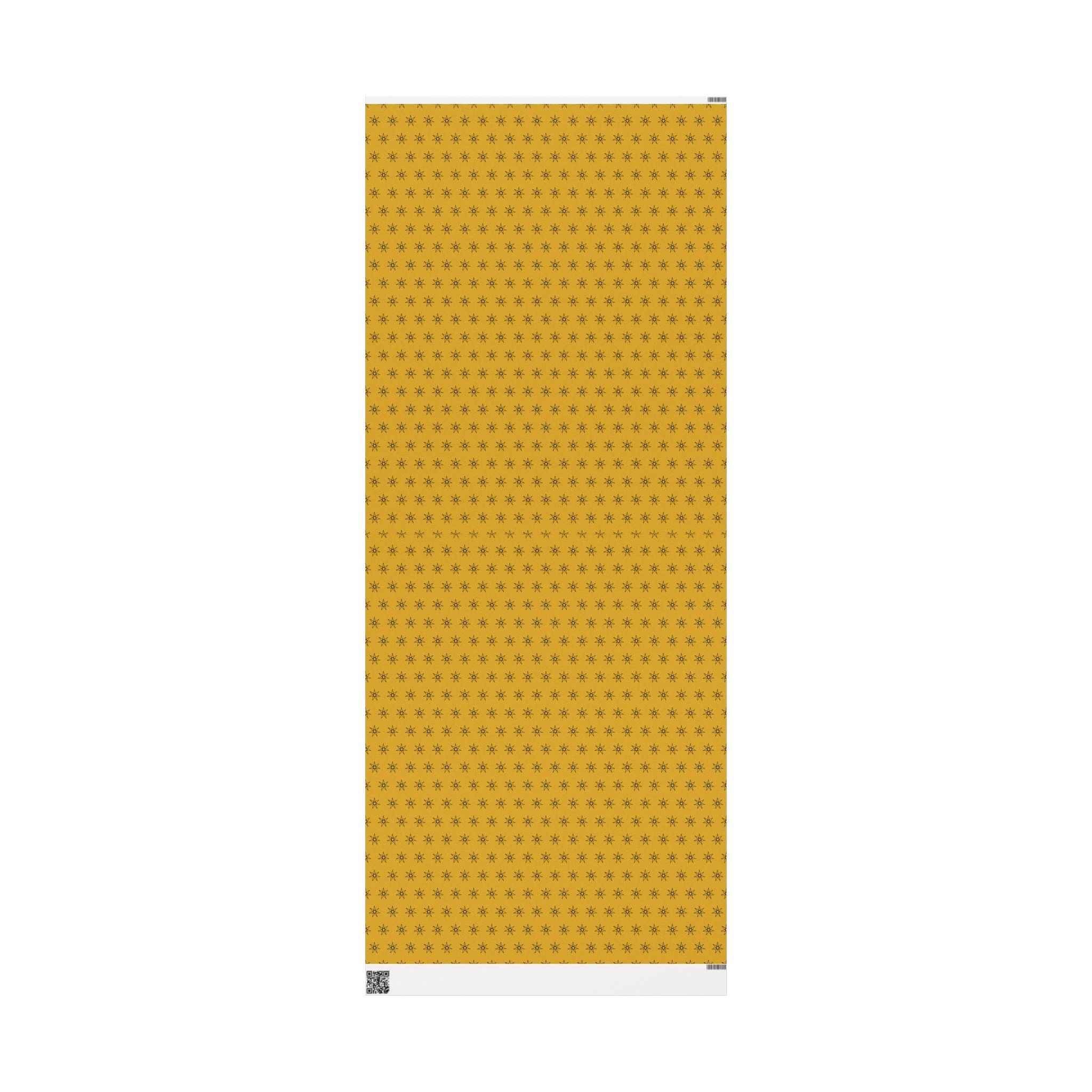 Yellow wrapping paper sheet with repeating seven-point stars, vertical view