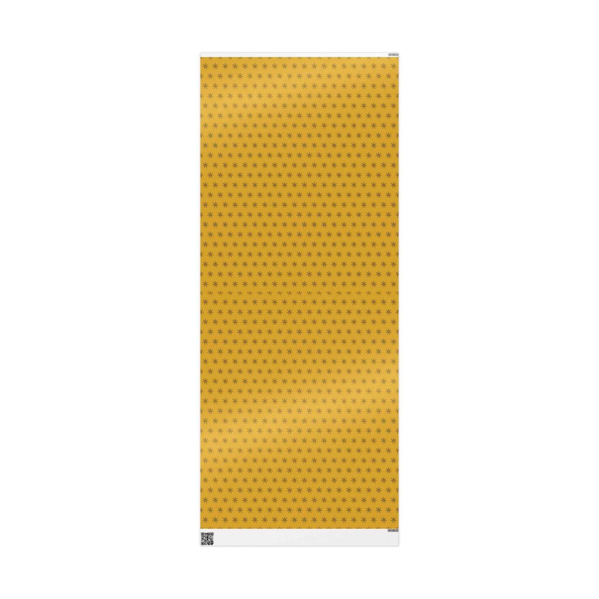Yellow wrapping paper sheet with small seven-point star icons, vertical view