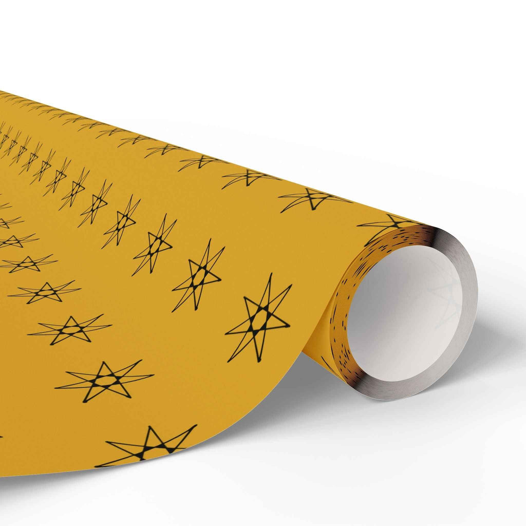 Seven-pointed star wrapping paper roll, yellow with black seven-point star pattern on core