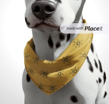 Mustard yellow clip-on dog bandana with black starburst pattern and triangle drape